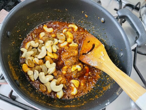Add salt and soaked dry dates, fried cashew nut and raisin,