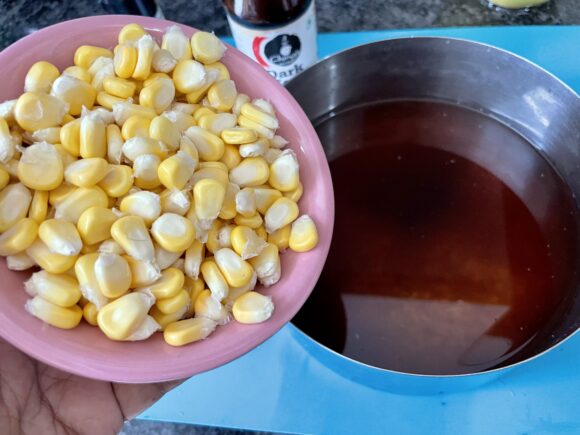 Add soya sauce and corn to soaked rice