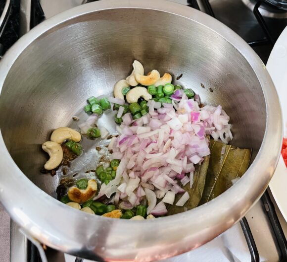 Add chopped beans; fry for 1 minute, add onion and carrot