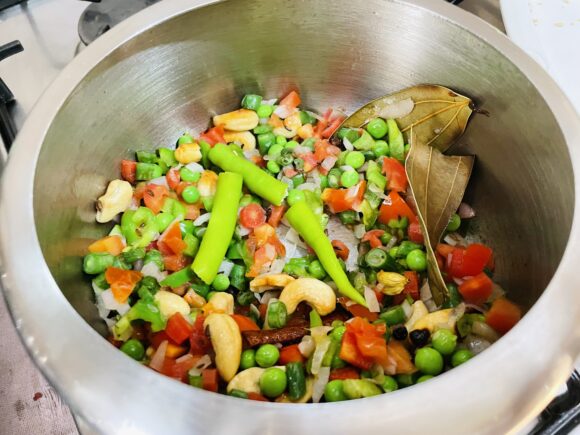 add washed steel cut oats and green chilli