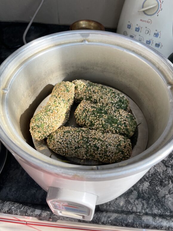 Roll sesame seed all around & steam