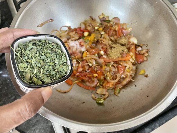 Add salt, coriander and cumin powder, turmeric powder and dried kasuri methy