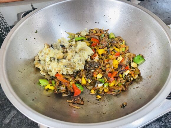 Add mashed brinjal