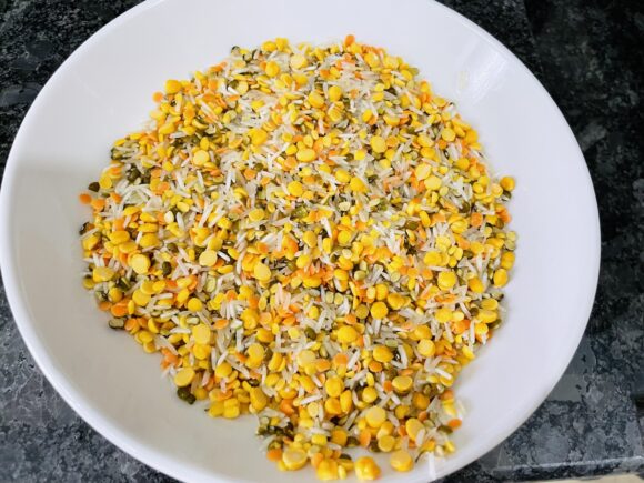Wash all five dals and rice thoroughly