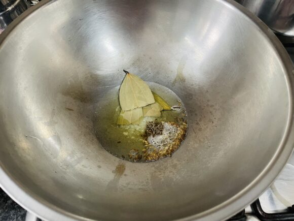 heat ghee. Add cumin, bay leaf, dry red chillies