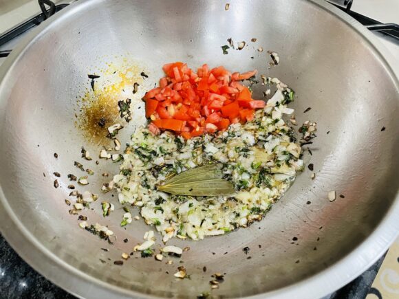 Add tomato, continue to cook