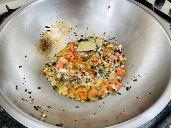 Add tomato, continue to cook