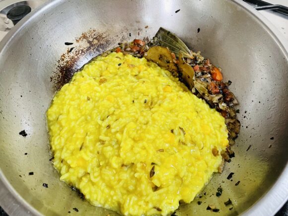 Add cooked dal and rice mix for tempering