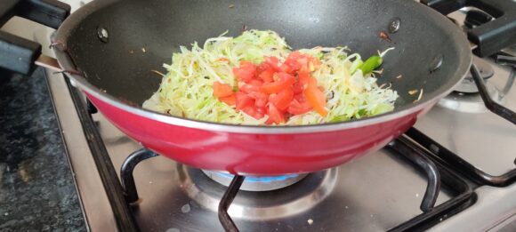 Add cabbage, tomato and peas in sequence