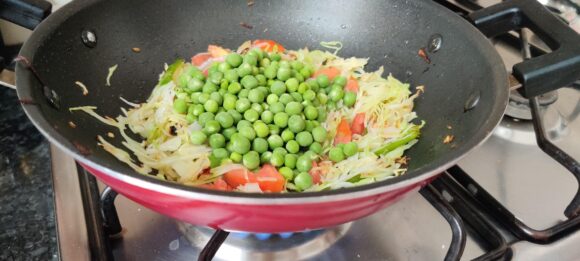 Add cabbage, tomato and peas in sequence