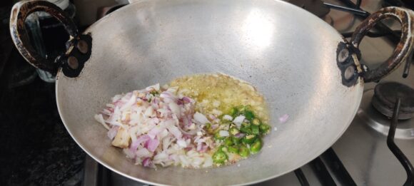 Add onion, green chilies and ginger