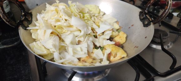 Add cabbage ( save small quantity for later use) 