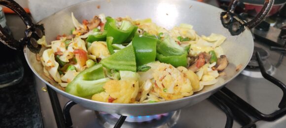 Add cabbage ( save small quantity for later use) and capsicum