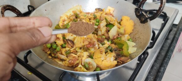 Add garam masala powder and add cabbage (saved) for more crunchiness, 