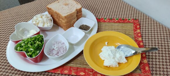 Put Hung curd, chopped Capsicum, Onion, Paneer, Salt and Pepper;