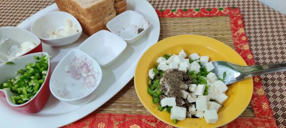 Put Hung curd, chopped Capsicum, Onion, Paneer, Salt and Pepper;