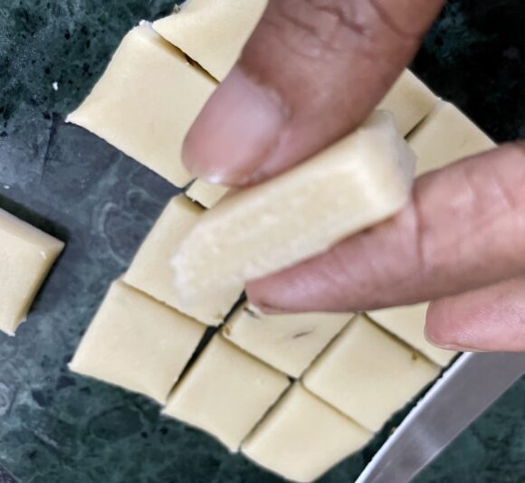 With a knife cut in square shapes, as shown in the photo