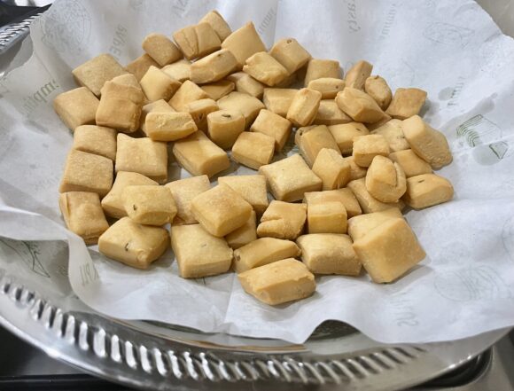 Take it out on the paper napkin to remove excess oil