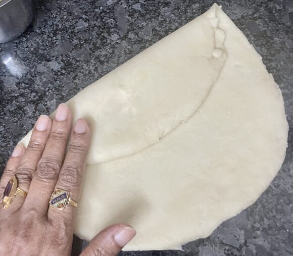 Roll the ball in 3-4” diameter circle and 1/6”  thick (slightly thicker than normal chapati). 
