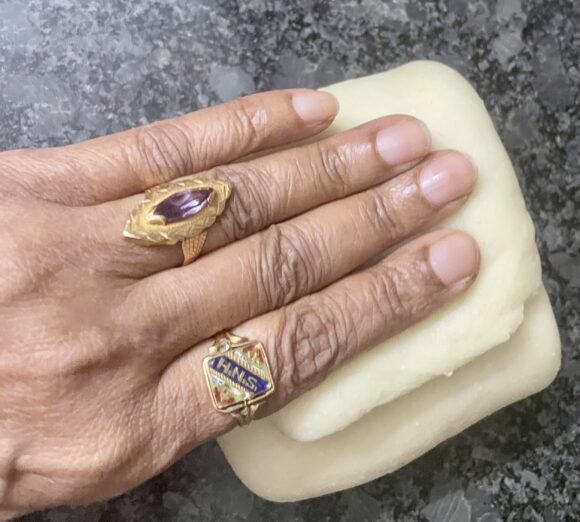 Apply ghee and fold once more three fold (total 9 fold)