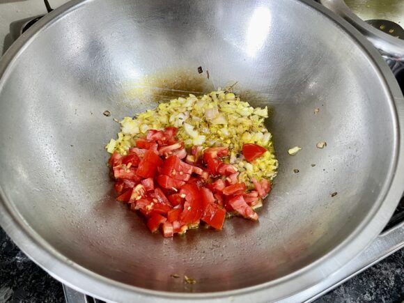 Add chopped tomato and coriander, cumin powder along with chilli powder