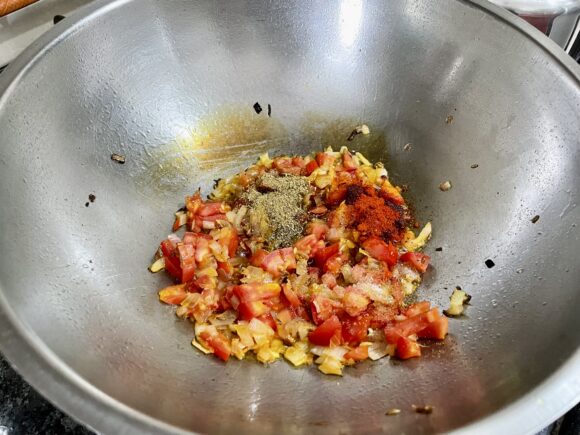 Add chopped tomato and coriander, cumin powder along with chilli powder