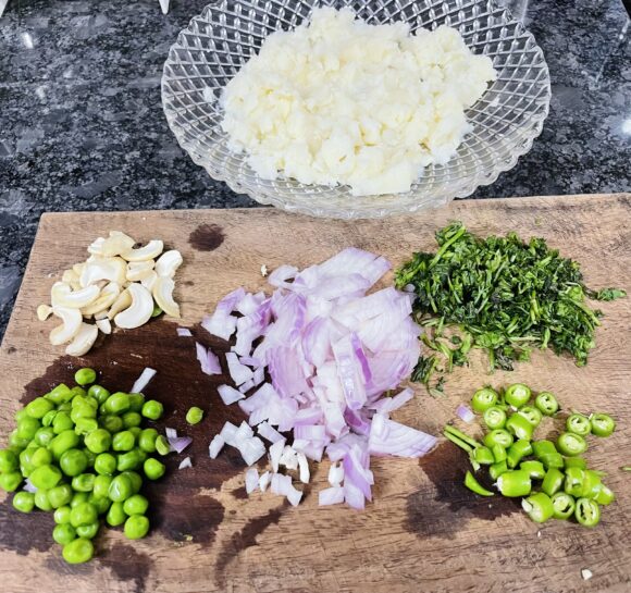 Chop onion, green chilli and coriander leaves into small pieces