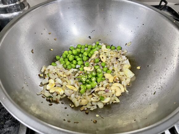 Add onion, green chilli and peas
