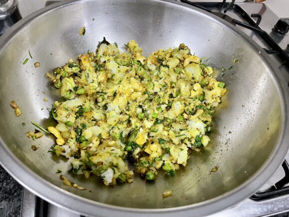 add 1 tablespoon of coriander leaves and boiled potatoes