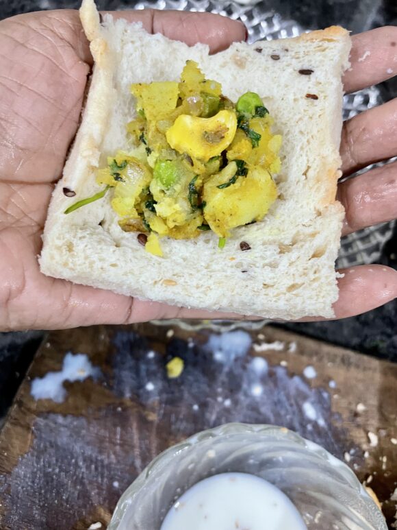 put prepared potato stuffing on the slice