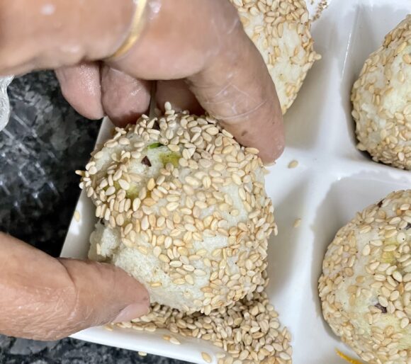 roll sesame seed all over the prepared ball