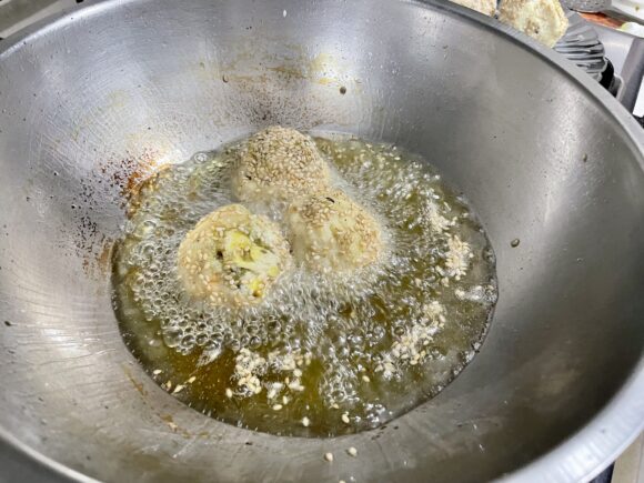 Deep fry the ball till golden colour appears all around;