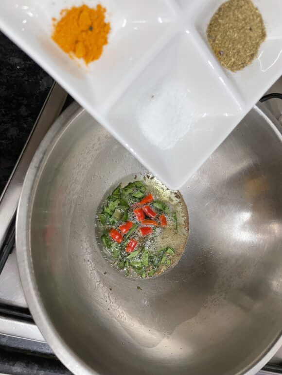 Add salt, turmeric powder, chilli powder and coriander powder
