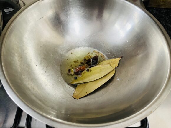 add whole garam masala and bay leaf