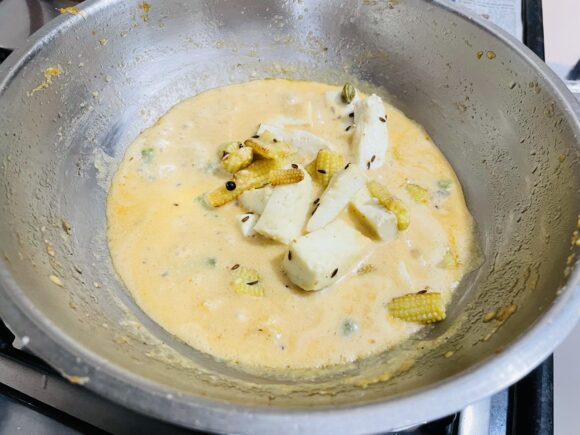 Add fried baby corn, paneer and green chilli