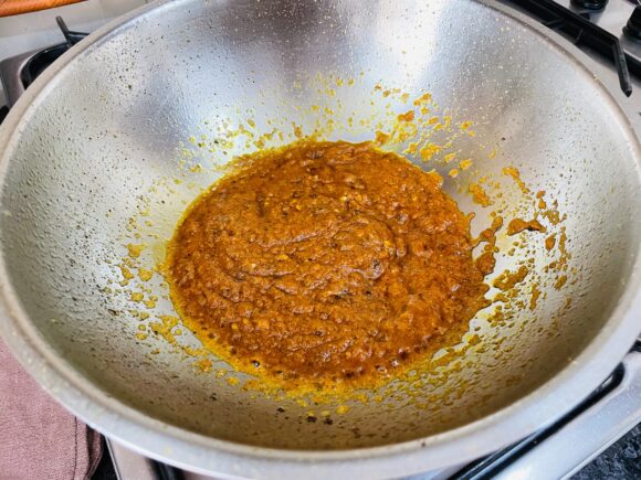 Add fresh cream; continue to fry until oil separate from masala.