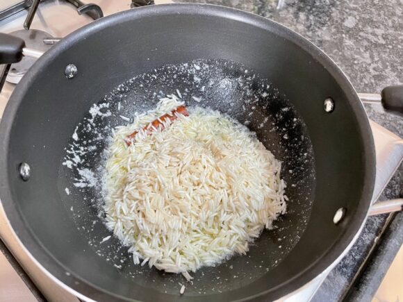 add washed rice and fry for couple of minutes on lower flame