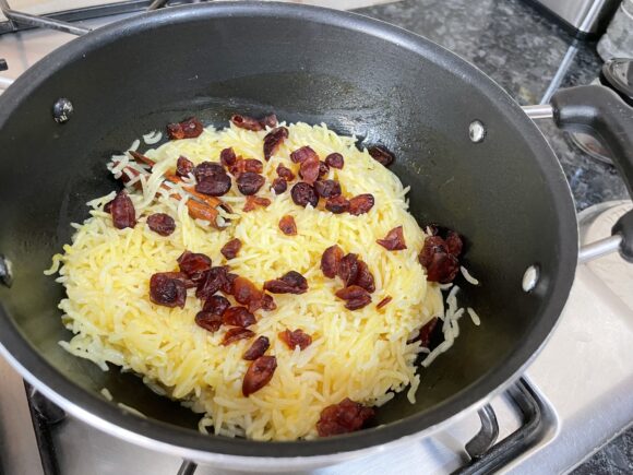 Add cranberry and serve as a pulao