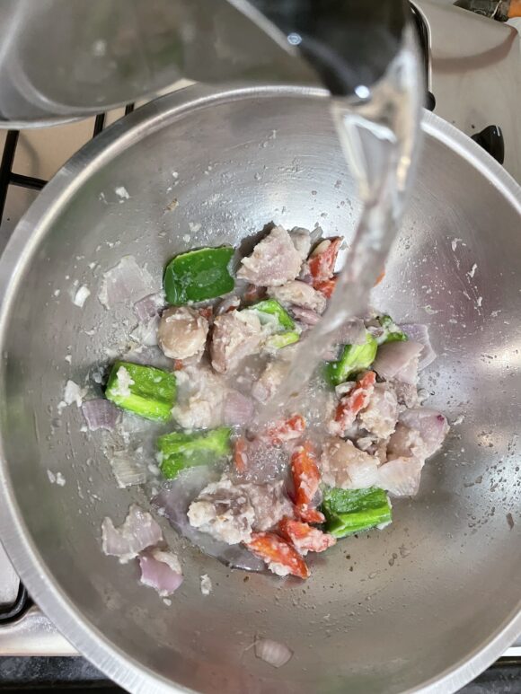 Add 1 cup of hot water, tomato sauce and corn flour slurry