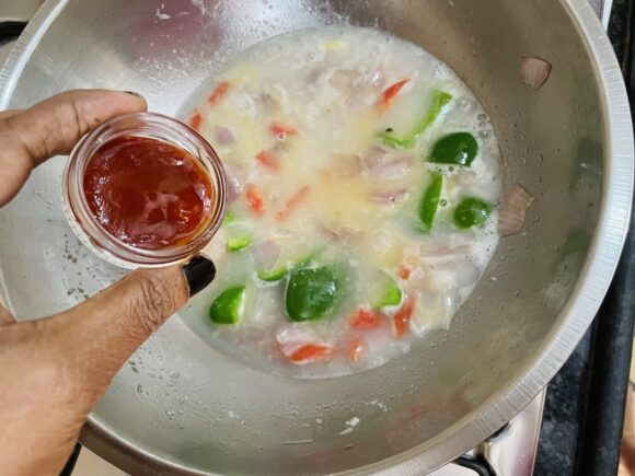 Add 1 cup of hot water, tomato sauce and corn flour slurry