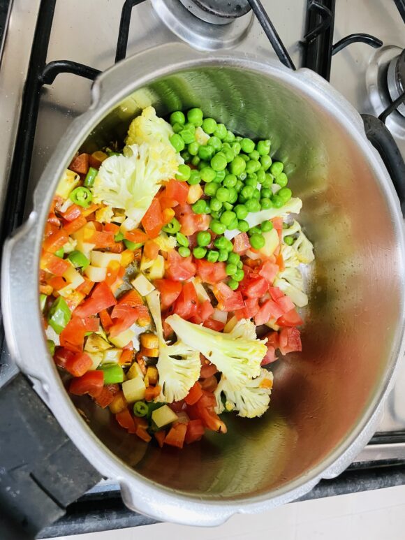 Add all vegetables and tomato