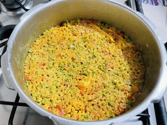 close the lid of pressure cooker; cook on high flame