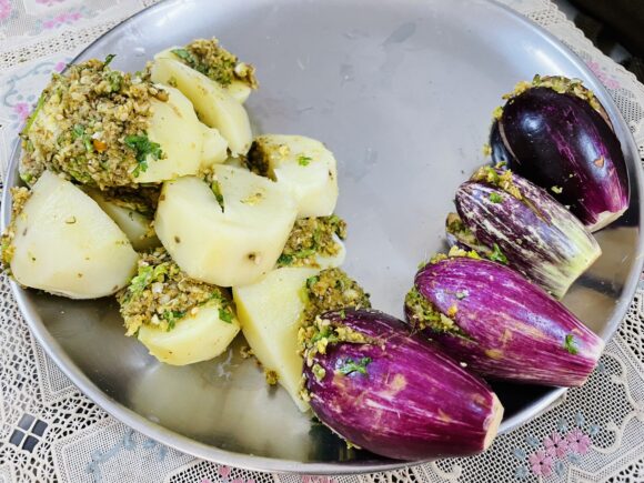Stuff eggplant and potato with prepared stuffing