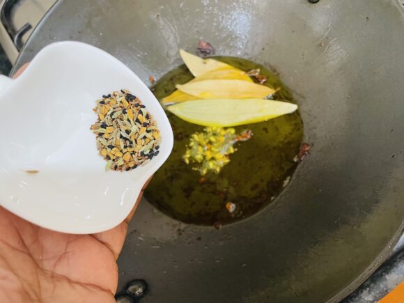 Add panch phoran and bay leaf 