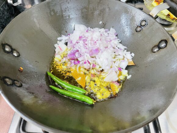 Add chopped onion and green chilli