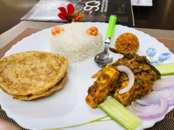 Achari Paneer – A Flavourful Blend of Pickle Spices”is ready to serve with Poori, Dost Paratha, Rice. 
