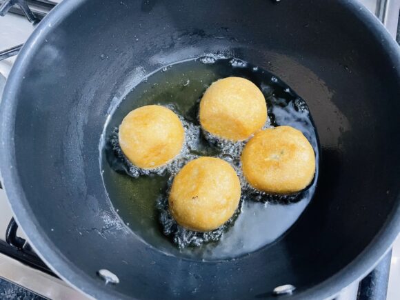 Deep fry the kachori until golden brown in colour all around.