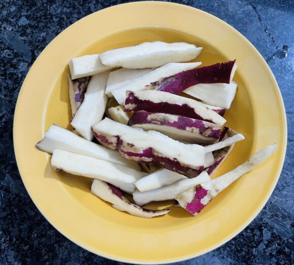 chop sweet potatoes into 1/2” thick and 3” long slices,