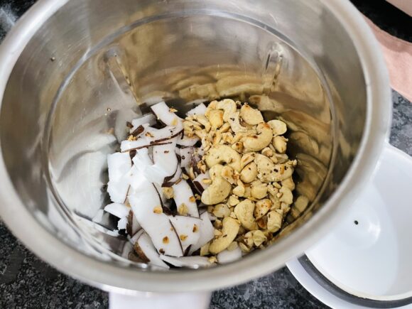 Take scraped coconut, cashew Nut, green chilli, salt and sugar into grinding jar