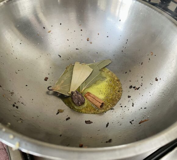 put cumin, bay leaf, black cardamom and cinnamon.